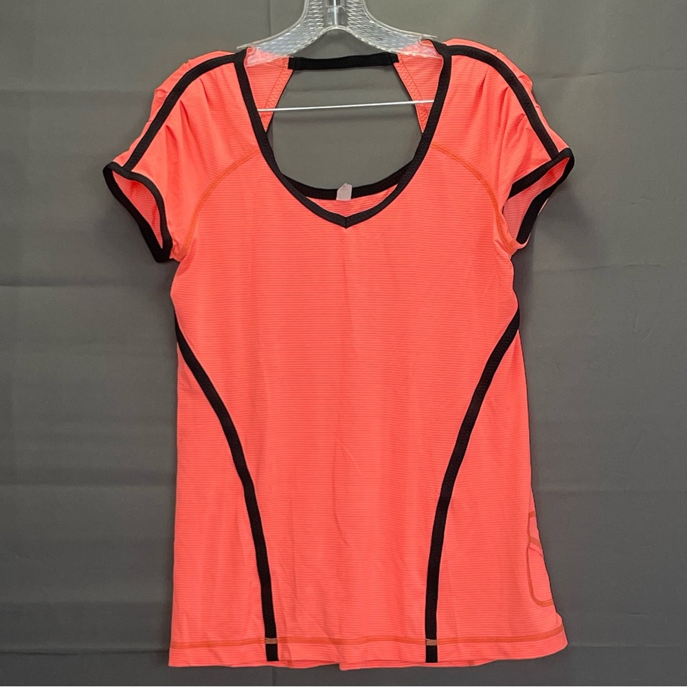 Neon pink/orange colour LULULEMON athletic top with open back and mp3 pocket